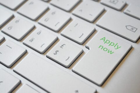 A picture of a keyboard that says apply now.